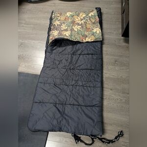 Classic Black Coleman Sleeping Bag with Leaf Pattern